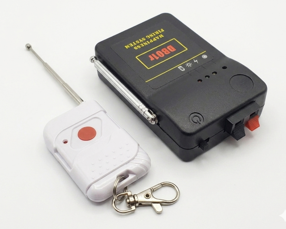 Black electronic device with a remote control on a white background