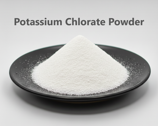 White potassium chloride powder on a black plate with a gray background