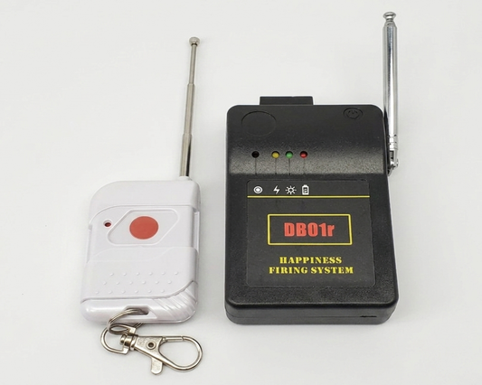 Black electronic device with antennas and a white remote control on a light gray background