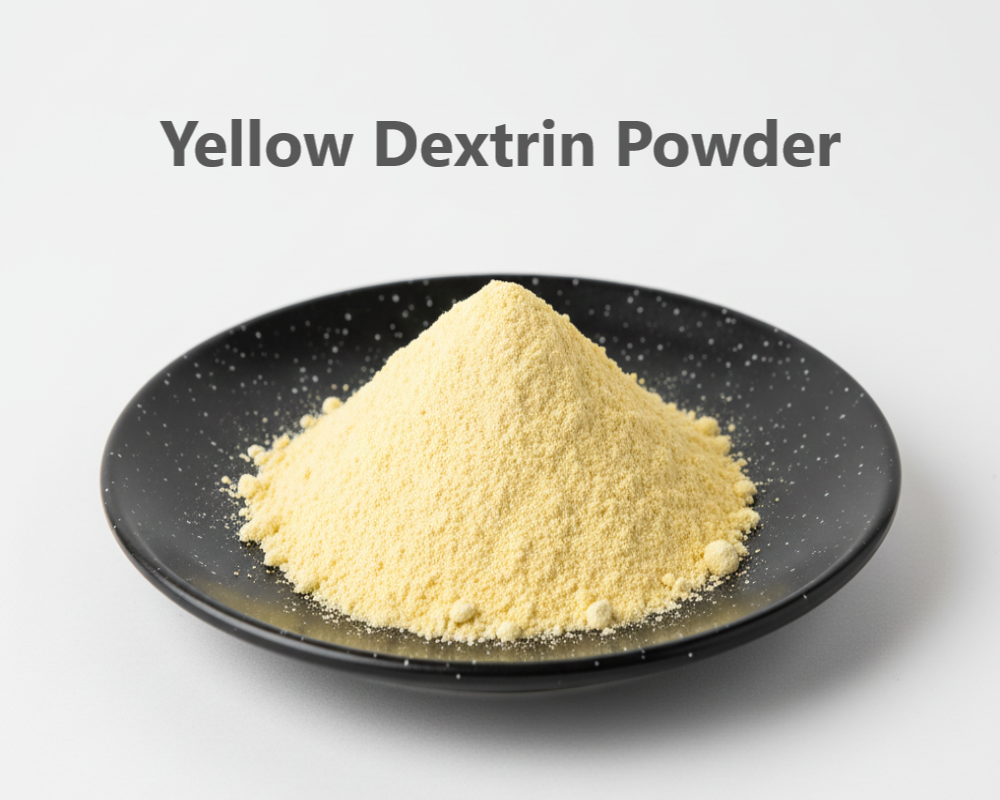 Yellow dextrin powder on a black plate with a white background